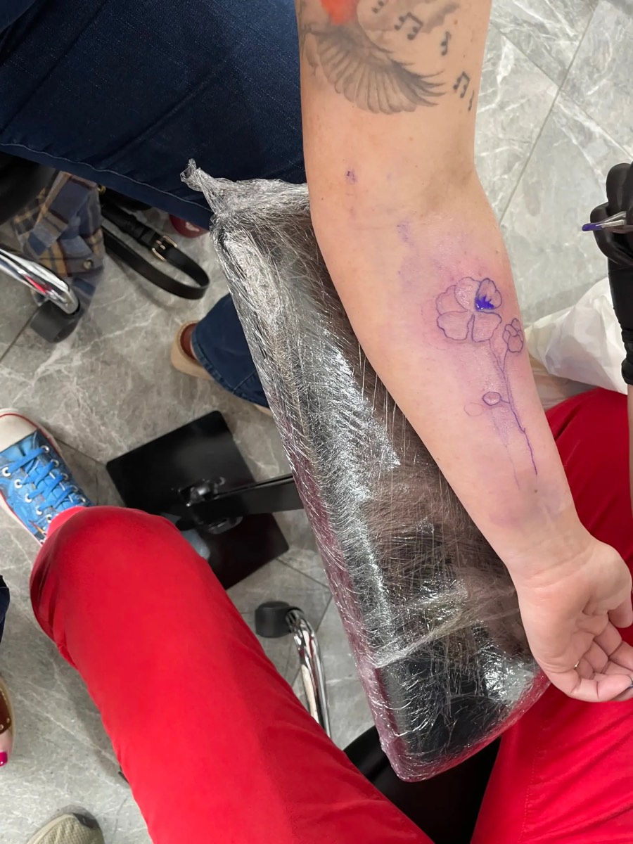 Flower tattoo stencil on forearm